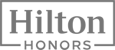The image shows the Hilton Honors logo, featuring "Hilton" in bold text inside a rectangle, with "HONORS" written below.