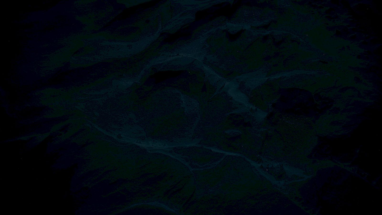 The image appears to be very dark, making it difficult to discern specific details or objects.